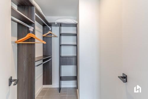 a room with a ladder and a closet at Downtown Miami Condos by Lua Host in Miami