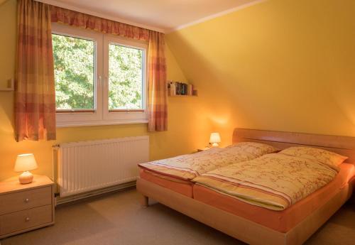 En eller flere senge i et værelse på Ferienwohnungen Müller