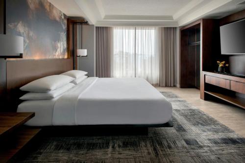 a large white bed in a hotel room at Richmond Marriott Short Pump in Short Pump