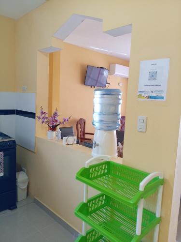 a room with a counter with a shelf with a container at Petite Lounge in Los Paredones