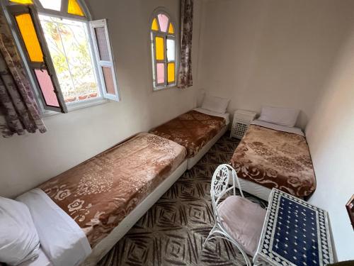 Postel nebo postele na pokoji v ubytování Daryussef 114