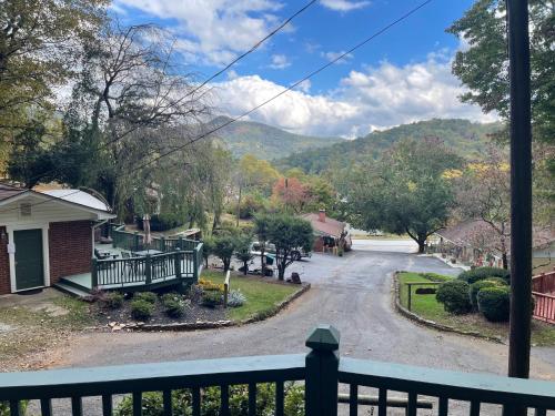 a view from a balcony of a residential street at Mountain Aire Cottages, Inn, & Glamping in Clayton