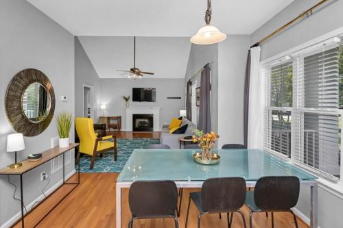 a kitchen and living room with a table and chairs at Walk to Stadium in Columbia