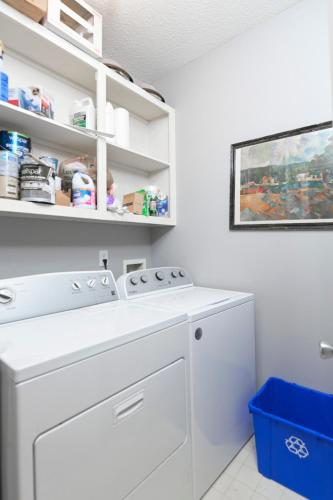a white washer and dryer in a laundry room at Walk to Stadium in Columbia