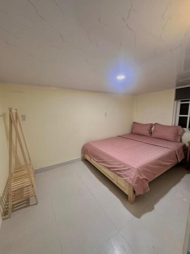 a bedroom with a bed and a ladder in it at Hùng Nam House in Khu Chi Lăng