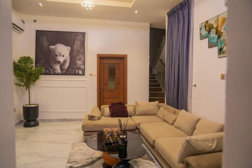 a living room with a couch and a table at 4 BED Serene Living - Magodo Phase 1 - 247 POWER in Magodo