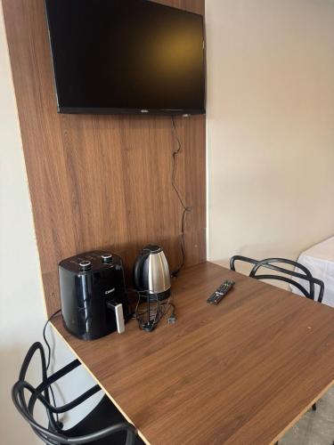 Televisyen dan/atau pusat hiburan di Flat - Conforto e Design Exclusivo