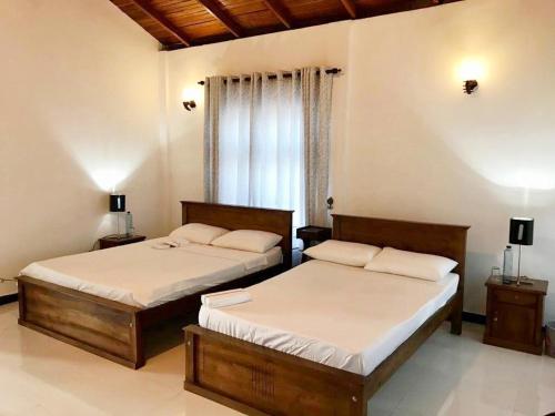 Ένα ή περισσότερα κρεβάτια σε δωμάτιο στο Lake Bungalow Layathraa Hatton
