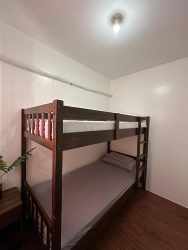a room with two bunk beds in it at Almond drive 2BR Townhouse Near SRP Nustar Talisay in Talisay