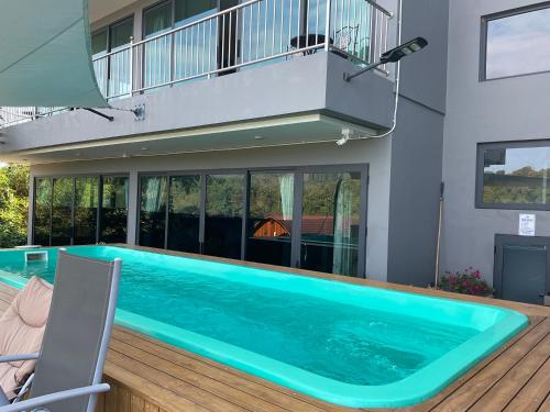 a swimming pool in the middle of a house at Seaview Eagles Nest Apartment 3 in Nai Harn Beach