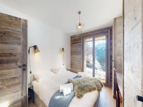 Ένα ή περισσότερα κρεβάτια σε δωμάτιο στο Cosy chalet in Vex with balcony