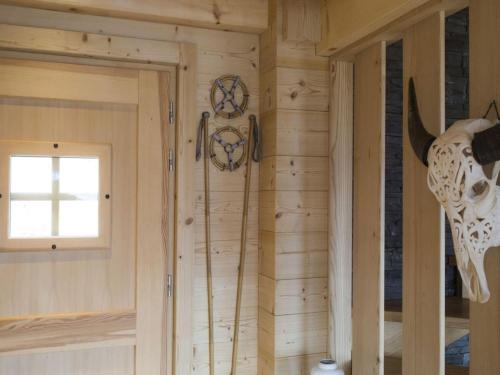 a room with wooden walls and a window at Chalet in Les Masses with garden in Agettes