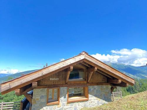 a log cabin on top of a mountain at Chalet in Les Masses with garden in Agettes