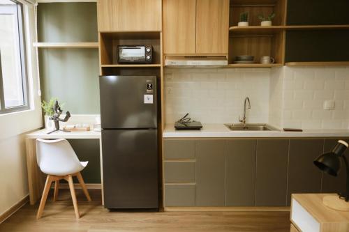 Kuchyň nebo kuchyňský kout v ubytování Katalonya Apartment Cikarang