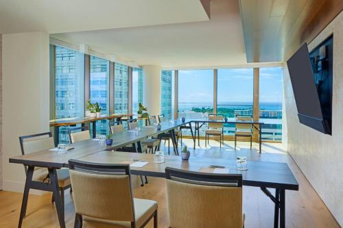 a conference room with tables and chairs and windows at Renaissance Honolulu Hotel & Spa in Honolulu