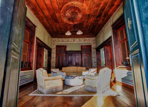 a living room with two chairs and a table at Guest House Old Plovdiv in Plovdiv
