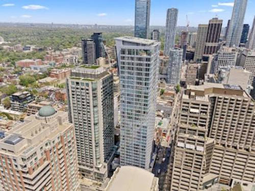 an aerial view of a city with tall buildings at Luxury 3-Beds Apartment in Yorkville with the Best City View in Downtown Toronto in Toronto