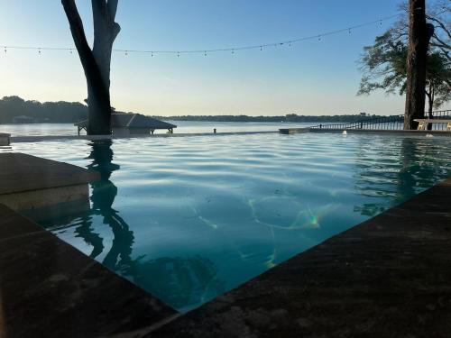 a pool of water with a tree in the middle at Retreat on Lake Athens in Athens