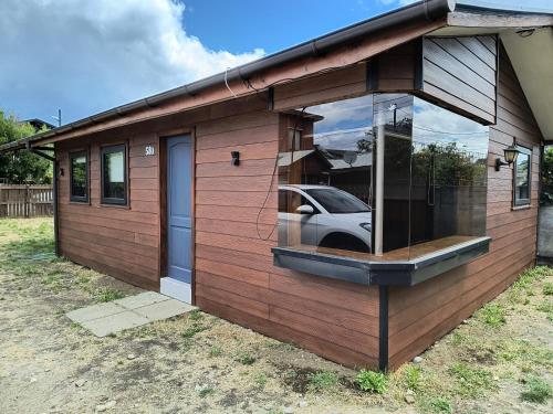 a small house with a car in the window at Arriendo Vacaciones Futrono in Futrono