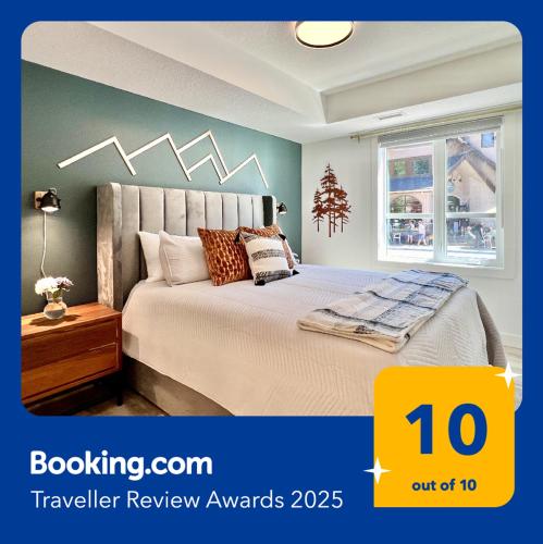 a bedroom with a bed and a window and avertisement at Special! New Downtown Mtn View Free Parking 2b&2b in Canmore