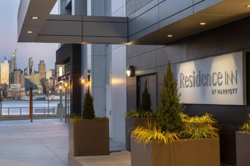a building with a sign on the side of it at Residence Inn by Marriott Weehawken in Weehawken