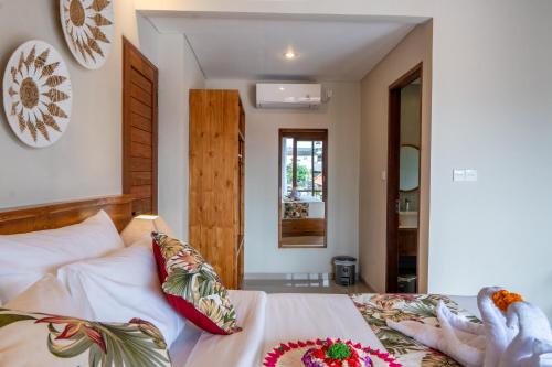 Ένα ή περισσότερα κρεβάτια σε δωμάτιο στο Meranggi Home Stay
