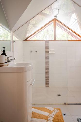 a bathroom with a shower and a sink at Bickley Tree Stay in Bickley
