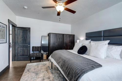 a bedroom with a large bed with a ceiling fan at Retreat at Jordanelle 1157 in Kamas