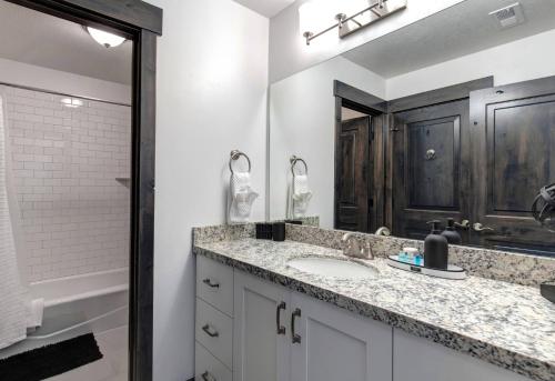 a bathroom with a sink and a mirror at Retreat at Jordanelle 1157 in Kamas