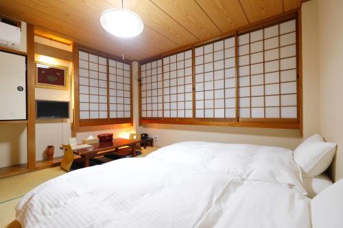 Postel nebo postele na pokoji v ubytování Nara Ryokan - Vacation STAY 49528v
