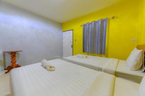 Una cama o camas en una habitación de Kongkhamkoon Hotel