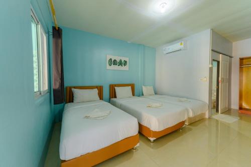 Una cama o camas en una habitación de Kongkhamkoon Hotel