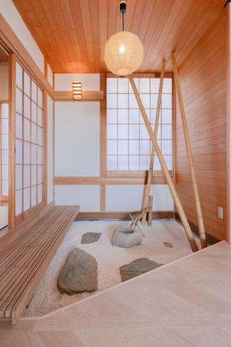 a room with a bed and a large window at Sea View Villa Atami in Atami