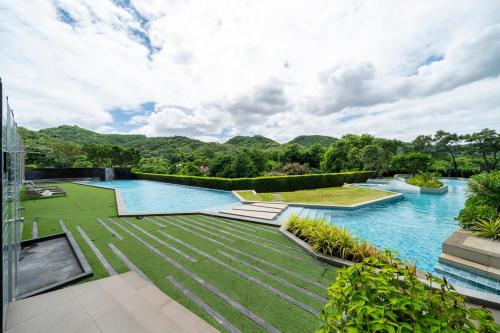 an image of a swimming pool on top of a building at Mountain-view 1BR 9F Sriracha byน้องมังคุด NoParking in Ban Fang Daeng