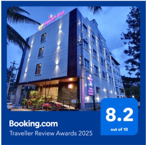 a hotel with a sign on the front of it at Click Hotel Vista-Kempegowda Airport in Bengaluru