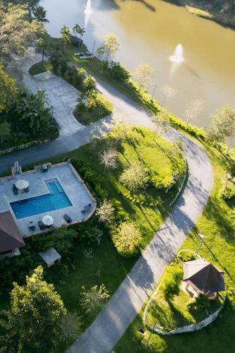 an aerial view of a house with a swimming pool at Katiliya Park Villa in Mae Chan