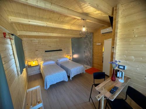 A bed or beds in a room at Dimora Rosso Piceno