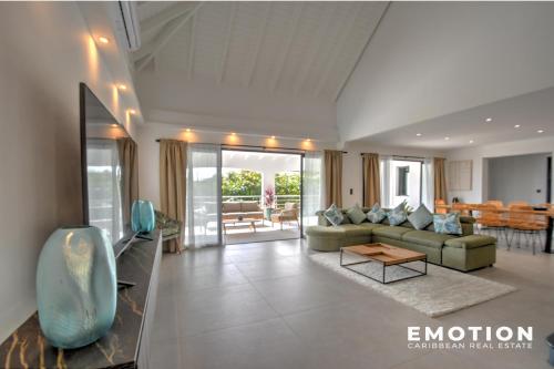 a living room with a couch and a table at New Seaside Elegance Luxury Villa in Oyster Pond - December 2024 renovated in Oyster Pond