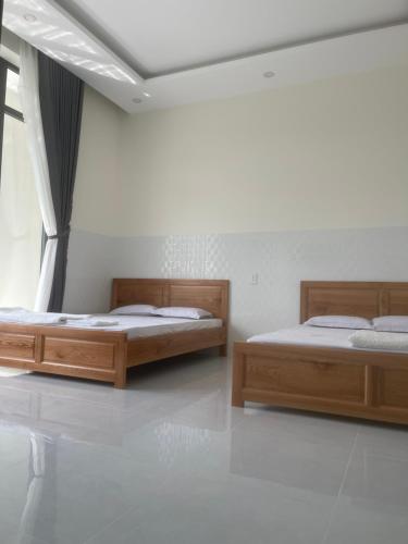 Postel nebo postele na pokoji v ubytování Hotel Gia Hân