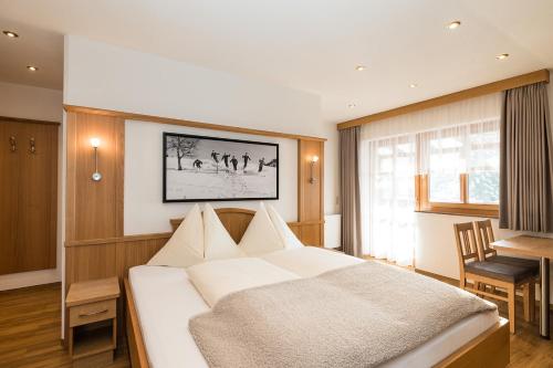 Apartments - Pension Florianにあるベッド