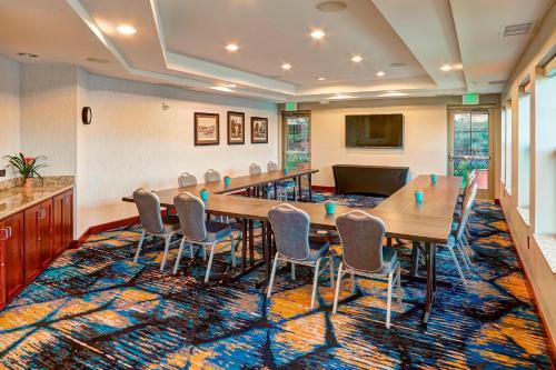 a conference room with a long table and chairs at Residence Inn Minneapolis Plymouth in Plymouth