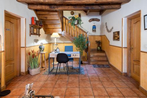 a home office with a desk and stairs at Matxingonea 1 in Urdax