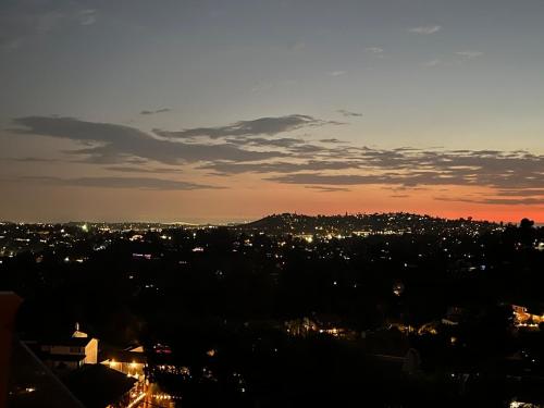 a view of a city skyline at night at Serenity - Amazing Views & Modern Charm in La Mesa