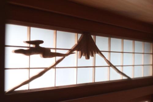 a kite is hanging from a window at デコピンハウス in Hanamaki