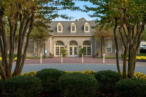 a large house with a lot of trees at Marriott's Manor Club at Ford's Colony in Williamsburg