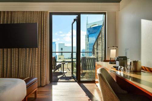a hotel room with a view of the city at The Bankers Alley Hotel Nashville, Tapestry Collection by Hilton in Nashville