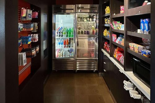 a refrigerator in a grocery store with its door open at Country Inn & Suites by Radisson, Convention Center in Altoona