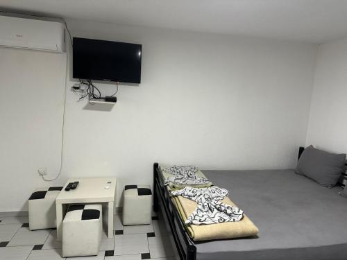 TV a/nebo společenská místnost v ubytování Apartments 64