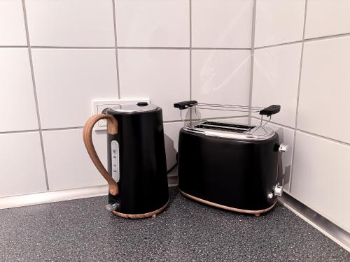 two coffins sitting on a counter in a bathroom at ThinkPink! Apartment im Herzen Dortmunds in Dortmund