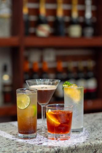 a group of four cocktails sitting on a counter at Dreamliner Hotel in Addis Ababa